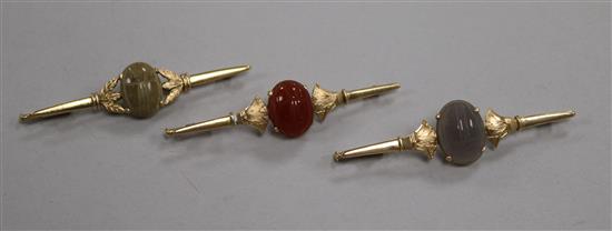A pair of yellow metal bar brooches and another similar, 20.5g gross